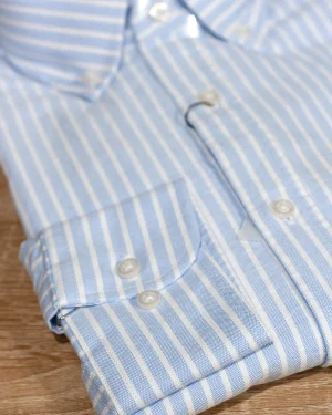 CAMISA OXFORD FONDO CELESTE Y RAYAS BLANCAS
